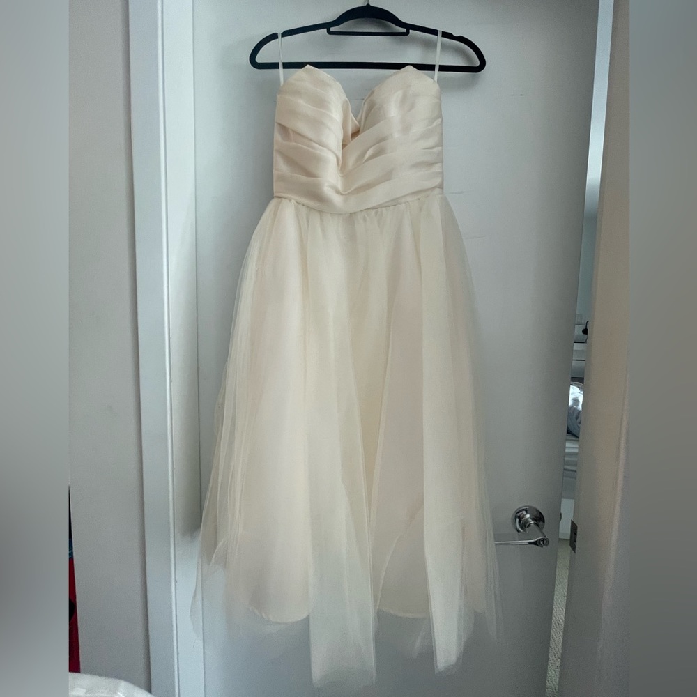 Wedding gown - tea length, size US10, %100 silk bodice.
